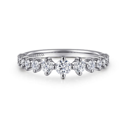The 14K White Gold Graduating Diamond Classic Ladies Ring by Gabriel & Co features a stackable design with a center diamond and smaller diamonds tapering along the band for an elegant look.