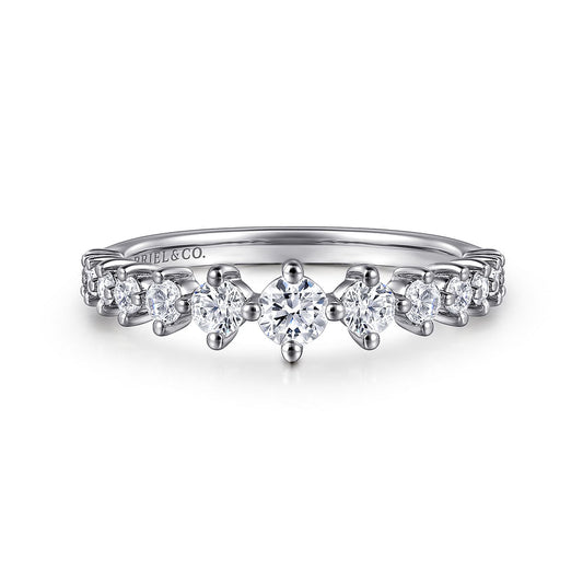 The 14K White Gold Graduating Diamond Classic Ladies Ring by Gabriel & Co features a stackable design with a center diamond and smaller diamonds tapering along the band for an elegant look.