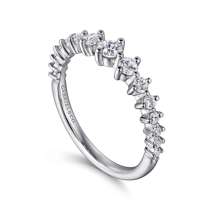 The Gabriel & Co 14K White Gold Graduating Diamond Classic Ladies Ring features a central diamond with smaller diamonds along the band and an inside engraving. Perfect for stacking and adding a touch of luxury.