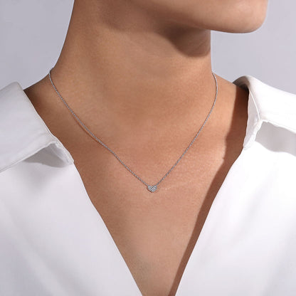 A person in a white collared shirt wears the Gabriel & Co 14K White Gold Pave Diamond Pendant Heart Necklace, with the image focusing on the neck and upper chest.