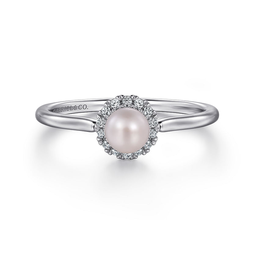 The Gabriel & Co 14K White Gold Pearl Ring with Diamond Halo features a central round pearl surrounded by sparkling diamonds, shown on a plain white background.