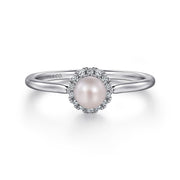 The Gabriel & Co 14K White Gold Pearl Ring with Diamond Halo features a central round pearl surrounded by sparkling diamonds, shown on a plain white background.