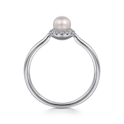 The Gabriel & Co 14K White Gold Pearl Ring with Diamond Halo showcases a single round pearl surrounded by sparkling diamonds, elegantly displayed against a white background.