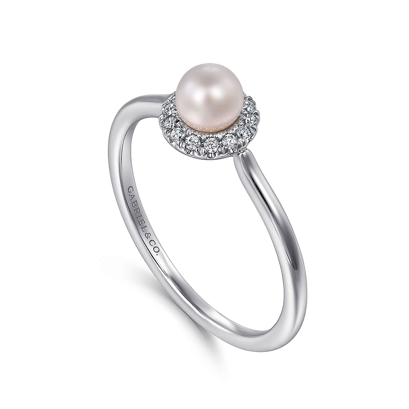 The Gabriel & Co 14K White Gold Pearl Ring with Diamond Halo features a round white pearl center surrounded by sparkling diamonds, shown on a plain white background.