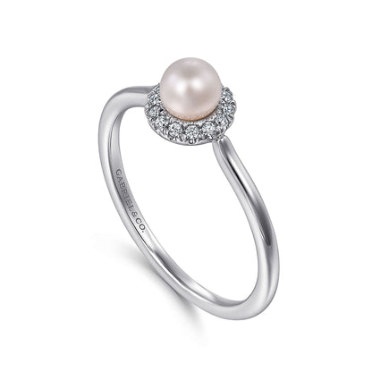 The Gabriel & Co 14K White Gold Pearl Ring with Diamond Halo features a round white pearl center surrounded by sparkling diamonds, shown on a plain white background.