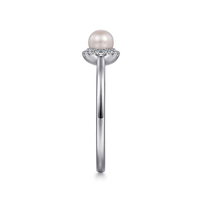 Side view of the Gabriel & Co 14K White Gold Pearl Ring with Diamond Halo, showcasing a round center pearl encircled by diamonds on a slim band, displayed against a white background.