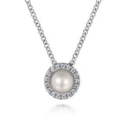 The Gabriel & Co 14K White Gold Pearl and Diamond Halo Pendant Necklace features a round pearl surrounded by sparkling diamonds, elegantly suspended from a fine chain.