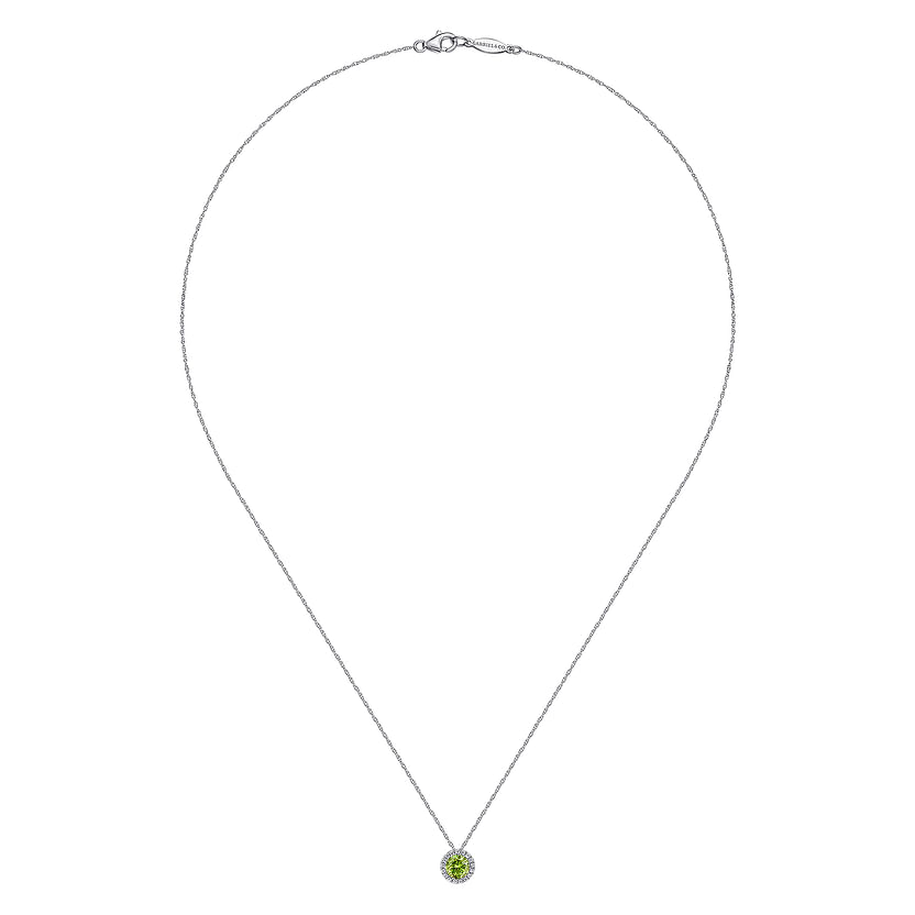 The Gabriel & Co 14K White Gold Peridot and Diamond Halo Pendant Necklace features a small round peridot accented by a diamond halo, displayed against a plain white background.