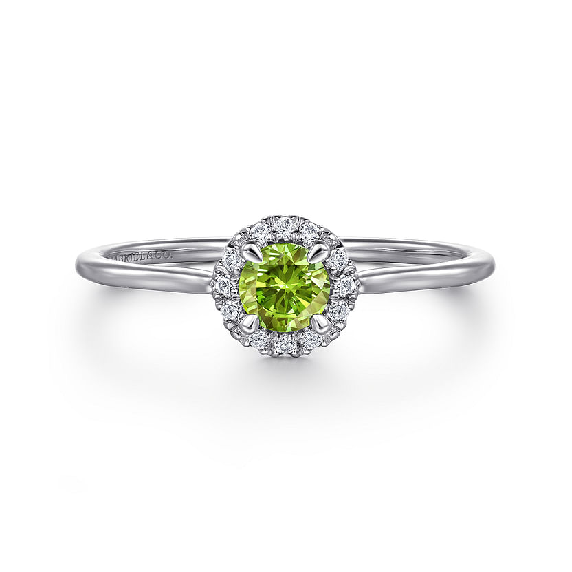 The Gabriel & Co 14K White Gold Peridot and Diamond Halo Promise Ring features a round green peridot center, accented with a sparkling diamond halo and shown against a white background.