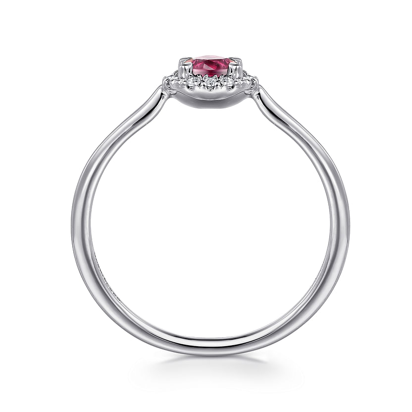 The Gabriel & Co 14K White Gold Pink Tourmaline and Diamond Halo Promise Ring showcases a round pink tourmaline center, surrounded by a sparkling diamond halo, elegantly displayed with its profile visible.
