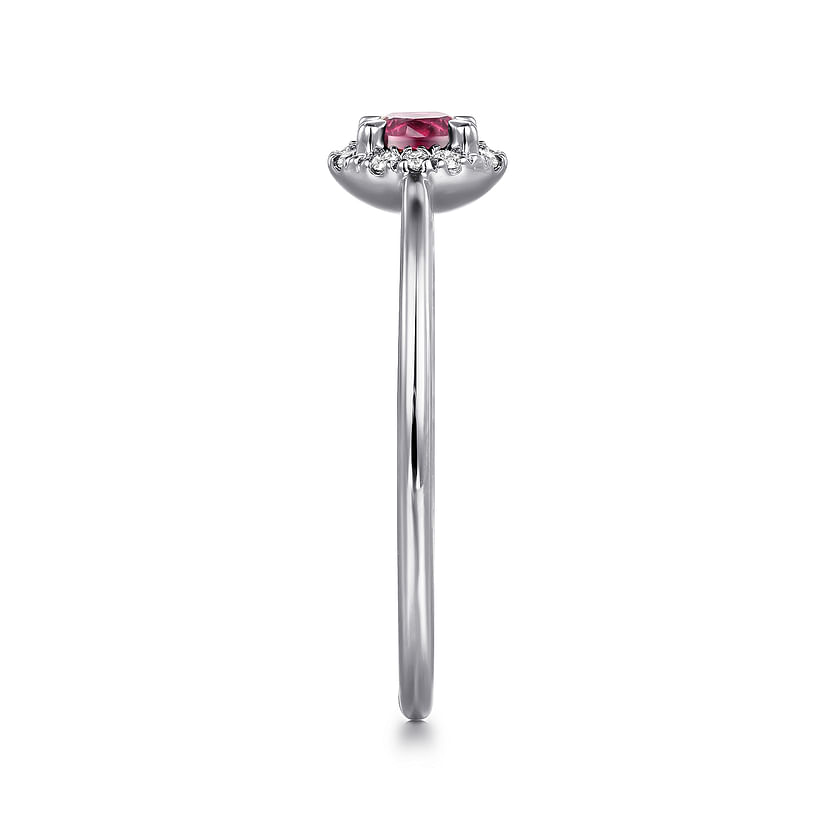 Side view of the Gabriel & Co 14K White Gold Pink Tourmaline and Diamond Halo Promise Ring, showcasing a round pink tourmaline center with diamond halo on a sleek band, set against a white background.