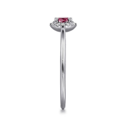 Side view of the Gabriel & Co 14K White Gold Pink Tourmaline and Diamond Halo Promise Ring, showcasing a round pink tourmaline center with diamond halo on a sleek band, set against a white background.