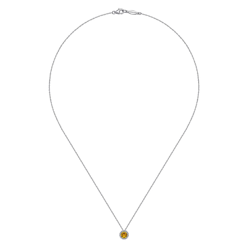 The Gabriel & Co 14K White Gold Round Citrine and Diamond Halo Pendant Necklace is showcased on a white background, highlighting its elegant citrine gemstone framed by sparkling diamonds.