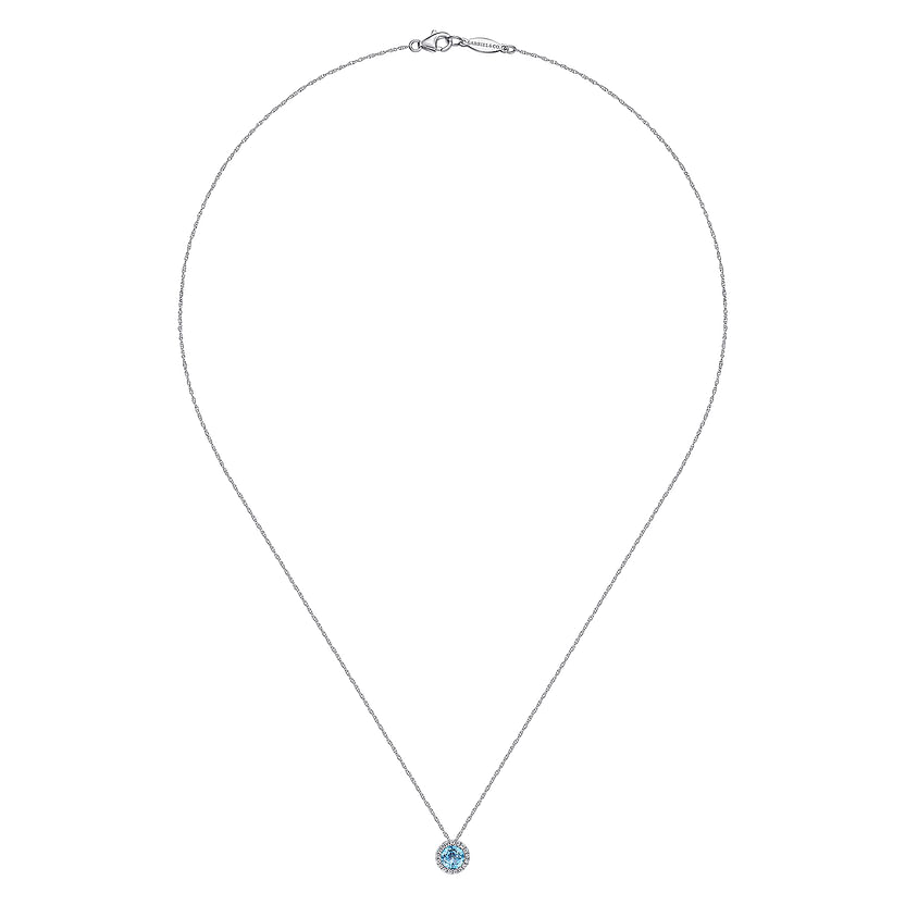 The Gabriel & Co 14K White Gold Round Swiss Blue Topaz and Diamond Halo Pendant Necklace is displayed in a teardrop shape on a white background, featuring a delicate chain and centered blue topaz pendant.