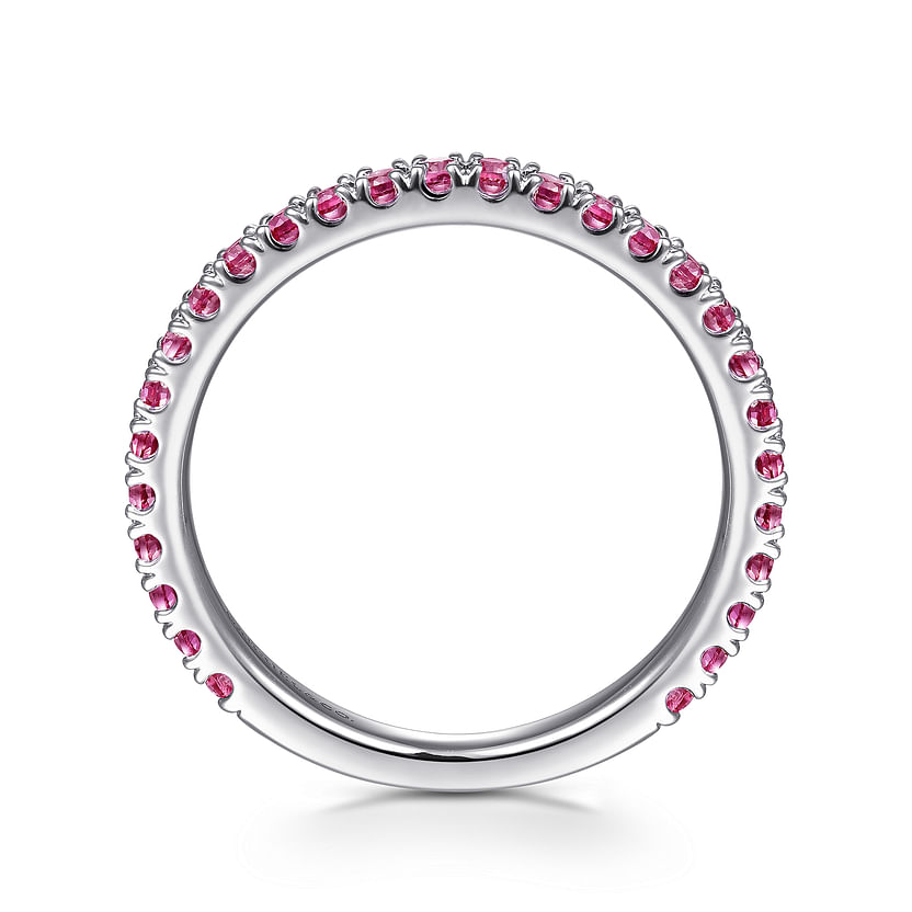 The Gabriel & Co 14K White Gold Ruby Stackable Ring features small round rubies set in a continuous line along the edge, shown upright on a white background.