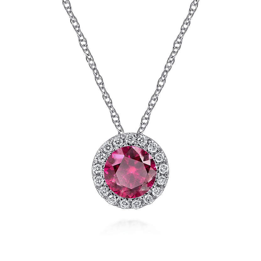 The Gabriel & Co 14K White Gold Ruby and Diamond Halo Pendant Necklace showcases a round ruby surrounded by sparkling diamonds—ideal July birthstone jewelry—displayed against a plain white background.