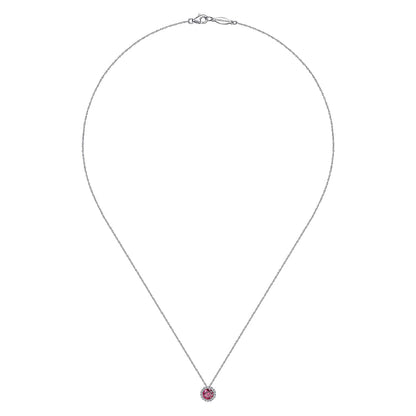 The Gabriel & Co 14K White Gold Ruby and Diamond Halo Pendant Necklace features a round ruby framed by sparkling diamonds, elegantly set in white gold and displayed against a white background.
