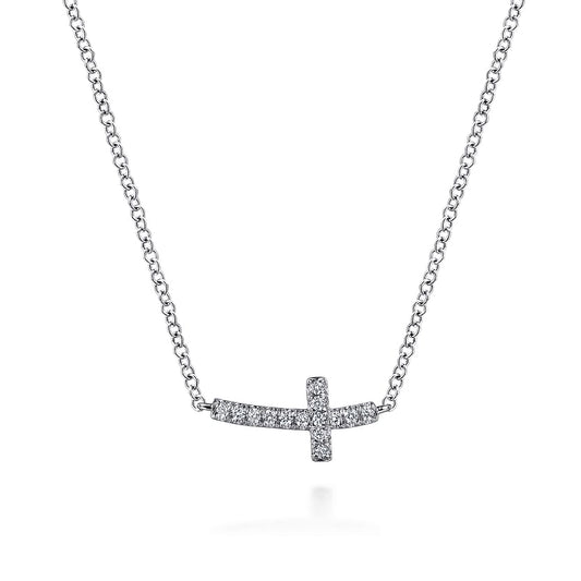 The Gabriel & Co 14K White Gold Sideways Curved Diamond Cross Necklace showcases a pavé diamond cross pendant on a delicate white gold chain, elegantly displayed on a white background.