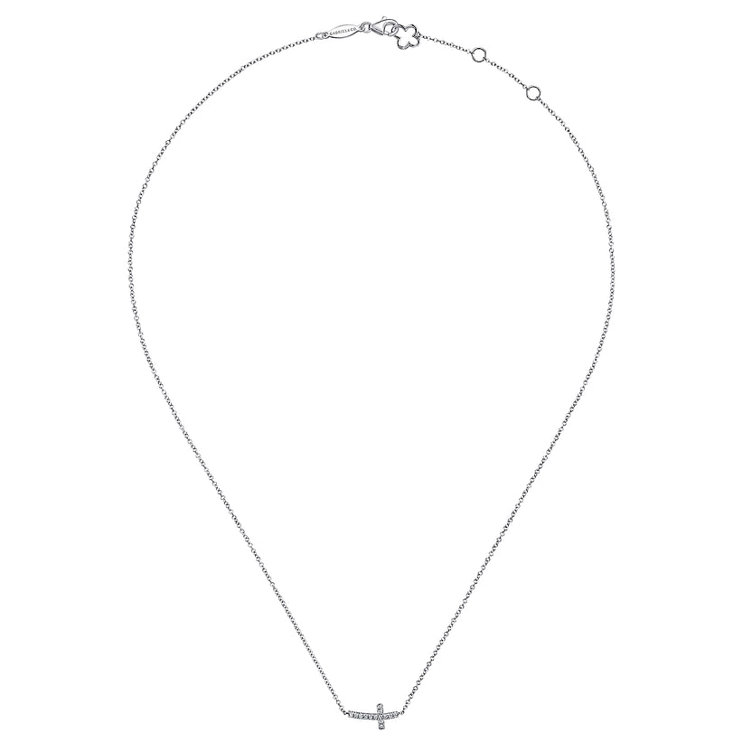 The Gabriel & Co 14K White Gold Sideways Curved Diamond Cross Necklace features a thin chain, a curved cross pendant, and an adjustable clasp with two small rounds for a timeless, elegant look.