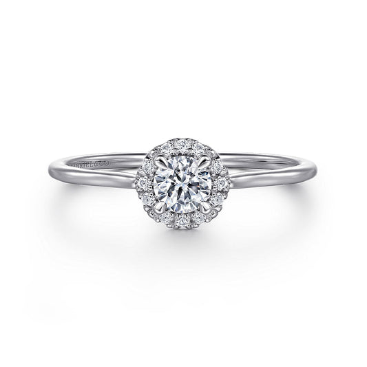 The Gabriel & Co 14K White Gold Promise Ring features a round white sapphire center, surrounded by a sparkling diamond halo on a slim, polished band.