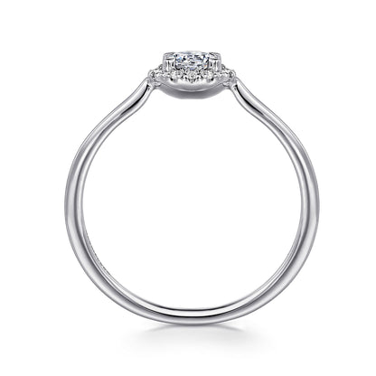 A side view of the Gabriel & Co 14K White Gold White Sapphire and Diamond Halo Promise Ring, featuring a sparkling white sapphire center with diamond accents in a halo setting.
