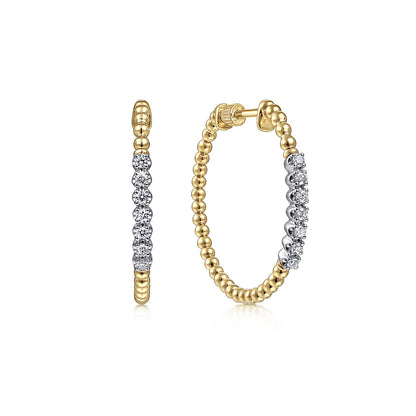 Gabriel & Co's 14K Yellow Gold 30mm Bujukan Diamond Classic Hoop Earrings feature a beaded design with a row of sparkling diamonds along the front, displayed against a plain white background.