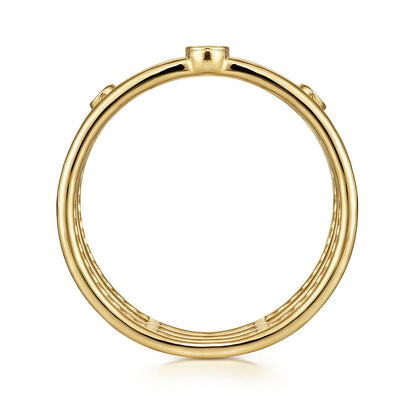 The 14K Yellow Gold Bezel Set Diamond Station Layered Ring by Gabriel & Co features a sleek, polished finish and circular shape, showcased from the side to emphasize its clean lines against a white background.