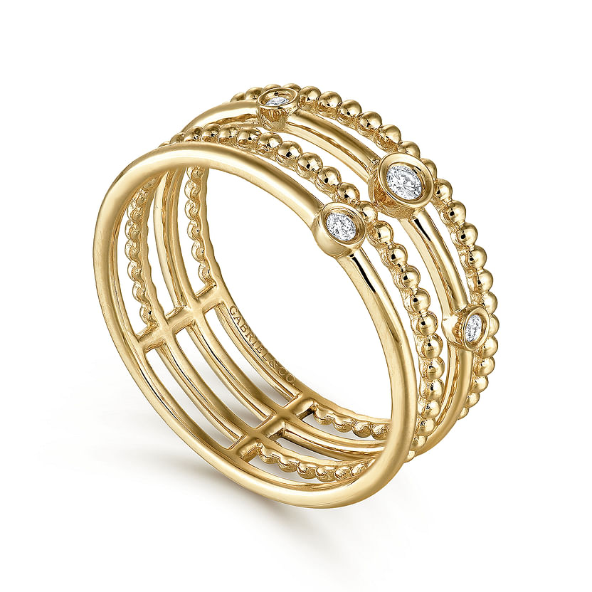 The Gabriel & Co 14K Yellow Gold Bezel Set Diamond Station Layered Ring features multiple intersecting bands, some adorned with bezel-set diamonds and others decorated with signature Bujukan beading.