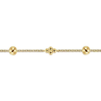 The Gabriel & Co 14K Yellow Gold Bujukan Beads Station Bracelet features evenly spaced beads, including a central cluster of three, and is displayed on a plain white background.