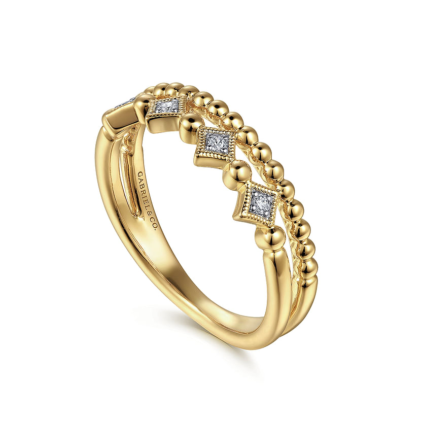 The 14K Yellow Gold Bujukan Diamond Easy Stackable Ring by Gabriel & Co features raised beads and geometric diamond-shaped accents with small diamonds, making it a beautifully detailed and perfect stackable ring.