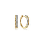 Gabriel & Co 14K Yellow Gold Bujukan Pave 10mm Diamond Huggie Earrings feature a row of small gold beads on one edge and sparkling white stones on the other, displayed against a white background.