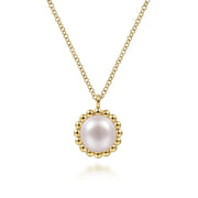 The Gabriel & Co 14K Yellow Gold Bujukan Pearl Pendant Necklace features a round pink pearl framed by a beaded gold border.