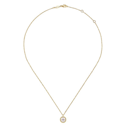 The 14K Yellow Gold Bujukan Pearl Pendant Necklace by Gabriel & Co features a round white pearl in a scalloped gold frame, shown on a white background. Discover timeless elegance in the Bujukan Collection.