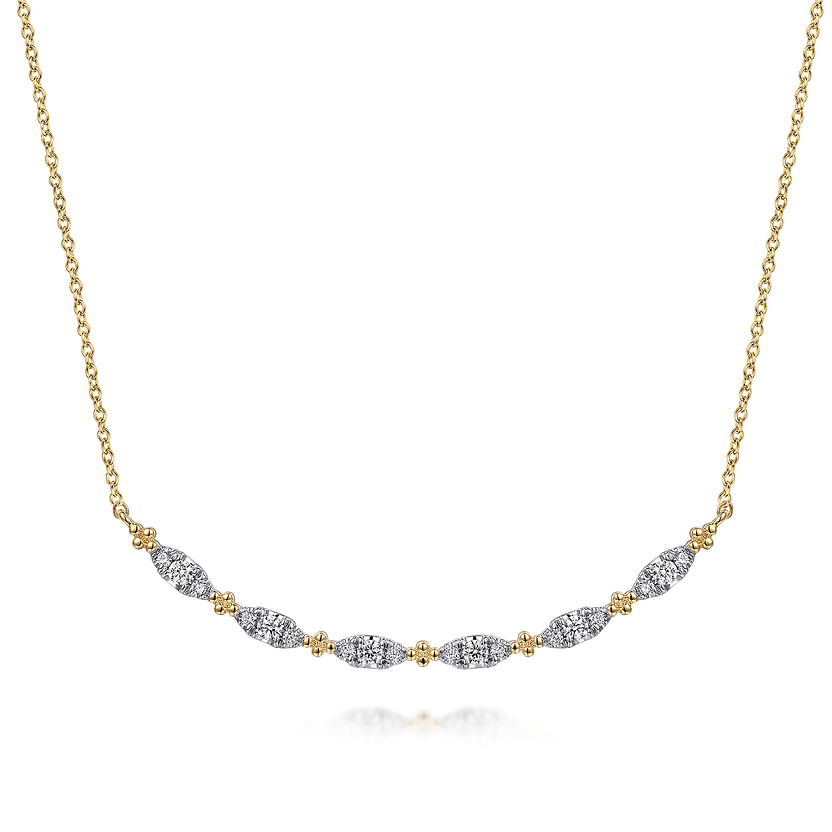 The Gabriel & Co 14K Yellow Gold Curved Bujukan Bar Diamond Necklace features a curved bar with alternating diamond-encrusted, leaf-shaped segments and gold bead accents.
