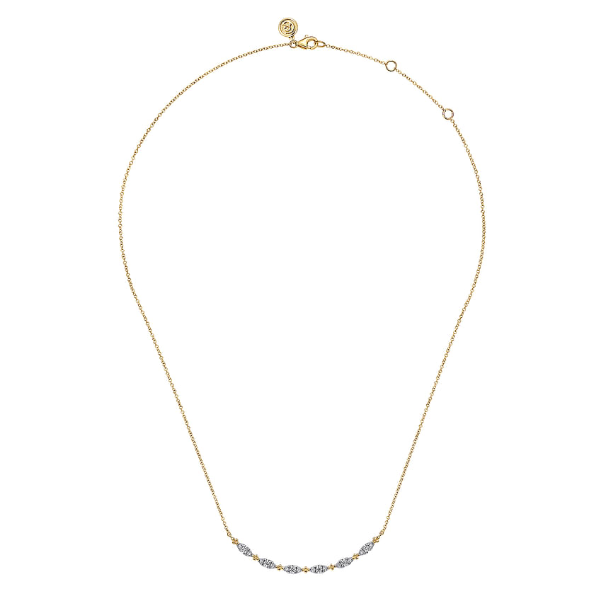 The Gabriel & Co 14K Yellow Gold Curved Bujukan Bar Diamond Necklace features a curved bar accented with diamonds on a delicate chain, finished with a simple clasp.