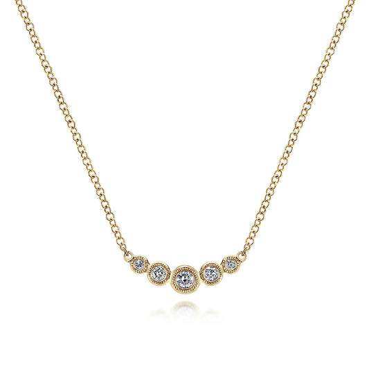 The Gabriel & Co 14K Yellow Gold Curved Diamond Bar Necklace features five bezel-set diamonds in a gentle curve, with a larger center stone for vintage charm on a classic white background.