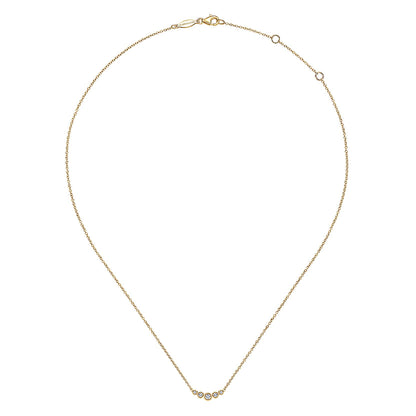 The Gabriel & Co 14K Yellow Gold Curved Diamond Bar Necklace features five round diamonds set along a delicate chain for a timeless, vintage-inspired look.
