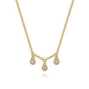 The 14K Yellow Gold Diamond Drop Pendant Necklace by Gabriel & Co features three round diamond pendants in delicate 14K yellow gold bezels for a refined, elegant look.