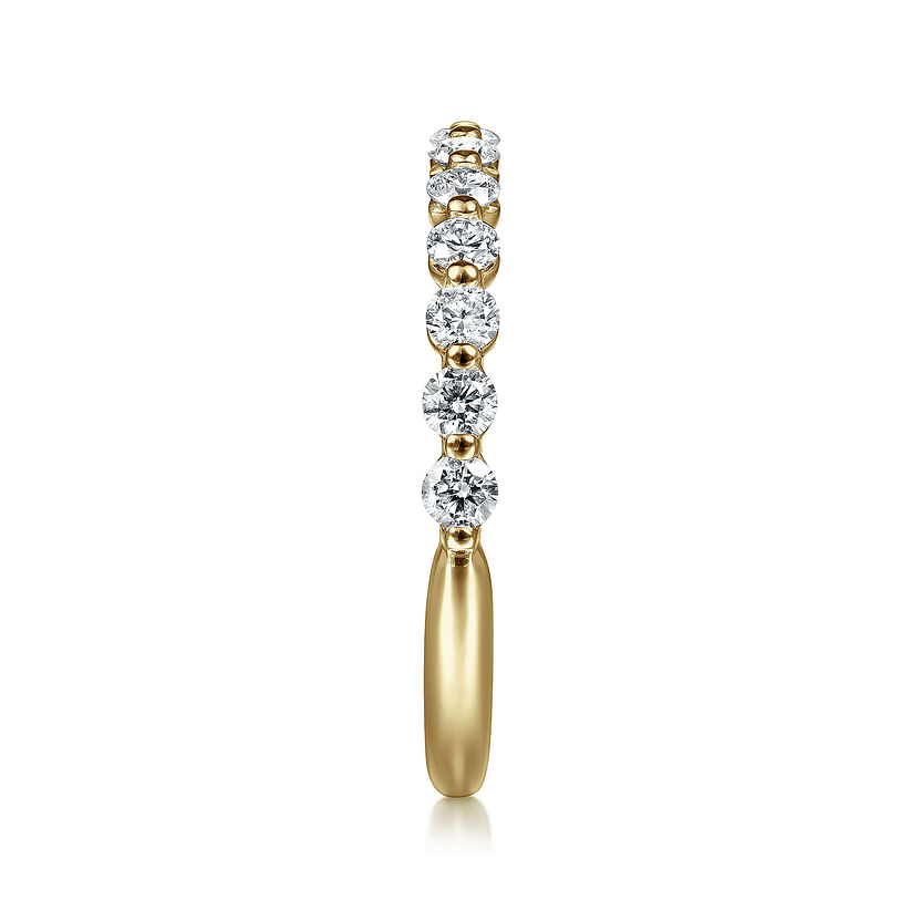 The Gabriel & Co 14K Yellow Gold Diamond Ladies Ring features seven natural diamonds set in a row along the upper band, shown from the front on a white background. Ideal for stacking and adding luxury to your look.