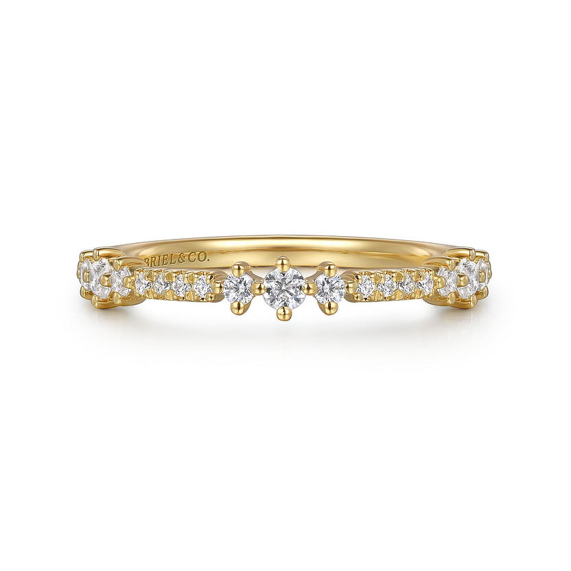 The 14K Yellow Gold Diamond Ladies Ring by Gabriel & Co features a row of small natural diamonds and a central star-like cluster. "GABRIEL & CO." is engraved inside the band. Ideal for stacking.