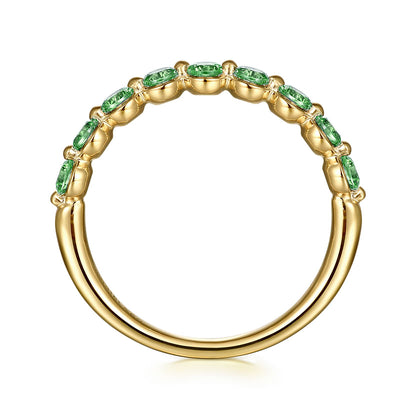 The 14K Yellow Gold Emerald Stackable Ring by Gabriel & Co features a row of oval green emeralds, the May birthstone, set along the top half, shown from the side on a white background.