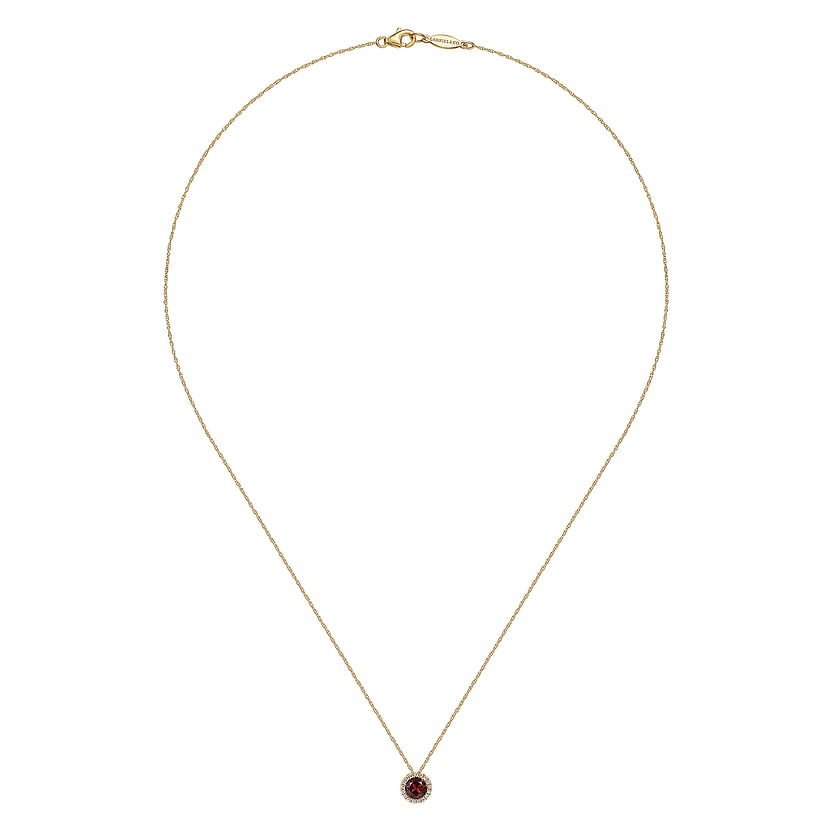 The Gabriel & Co 14K Yellow Gold Garnet and Diamond Halo Pendant Necklace features a delicate gold chain and a round garnet center accented by a sparkling diamond halo.