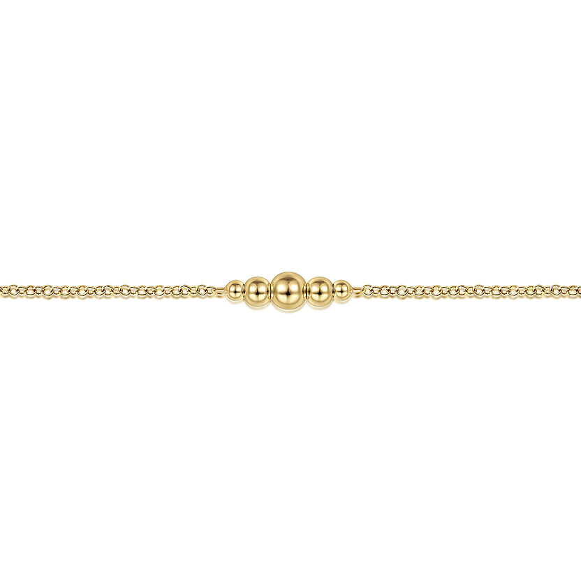 The Gabriel & Co 14K Yellow Gold Graduating Bead Stations Bracelet features five polished beads in a row, decreasing in size from the center outward—perfect for stacking and shown against a white background.