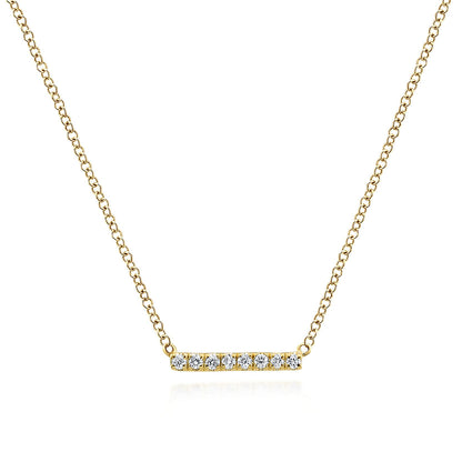 The Gabriel & Co 14K Yellow Gold Petite Pave Diamond Bar Necklace showcases a minimalist horizontal bar pendant set with seven sparkling diamonds, shown on a white background.