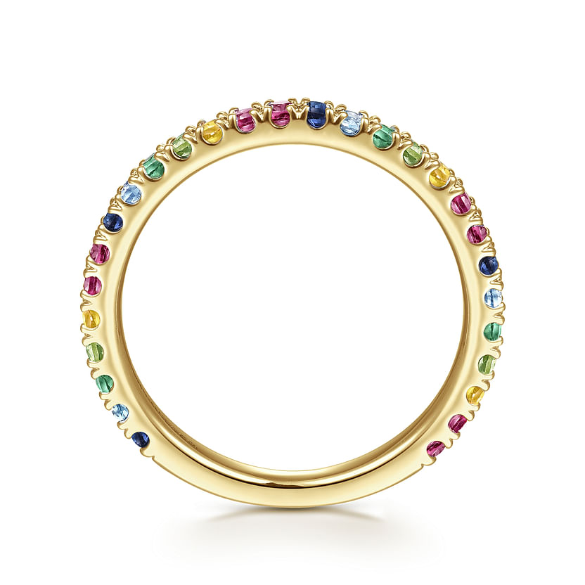 The Gabriel & Co 14K Yellow Gold Rainbow Color Stone Stackable Ring features small, round blue, green, yellow, red, and pink gemstones encircling the slim band for a dazzling multicolor look.