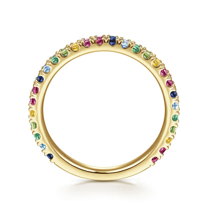 The Gabriel & Co 14K Yellow Gold Rainbow Color Stone Stackable Ring features small, round blue, green, yellow, red, and pink gemstones encircling the slim band for a dazzling multicolor look.