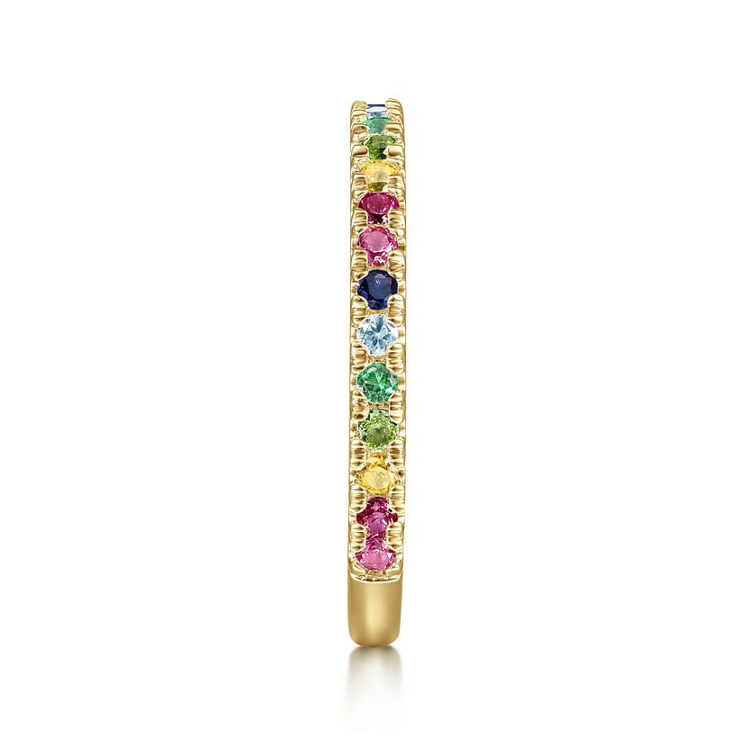 The Gabriel & Co 14K Yellow Gold Rainbow Color Stone Stackable Ring features small, round multicolor gemstones set in a thin band, shown from the side on a white background.