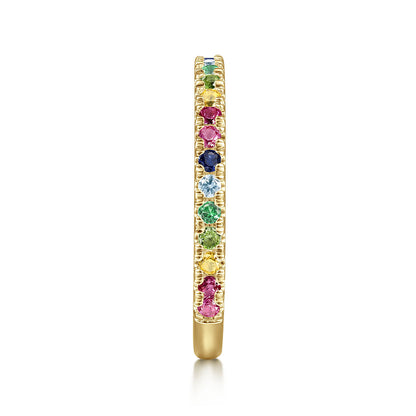 The Gabriel & Co 14K Yellow Gold Rainbow Color Stone Stackable Ring features small, round multicolor gemstones set in a thin band, shown from the side on a white background.