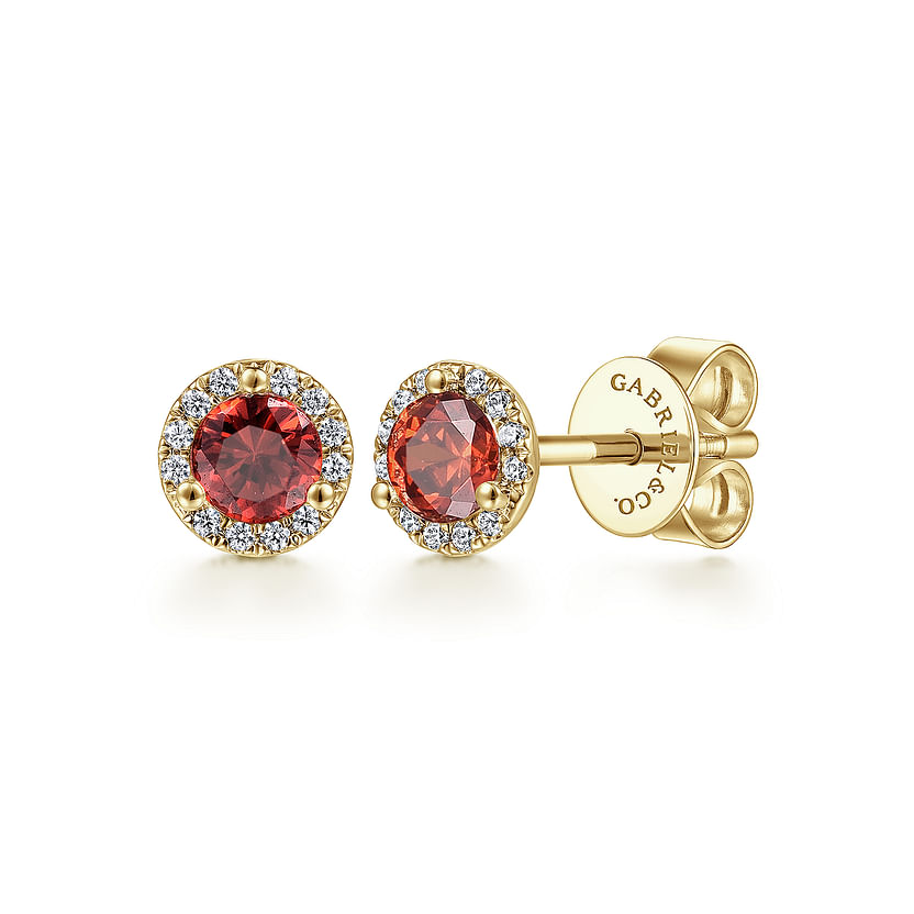 Gabriel & Co 14K Yellow Gold Round Halo Garnet and Diamond Stud Earrings feature round garnet gems encircled by small diamonds in a halo design and have secure screw-back closures.