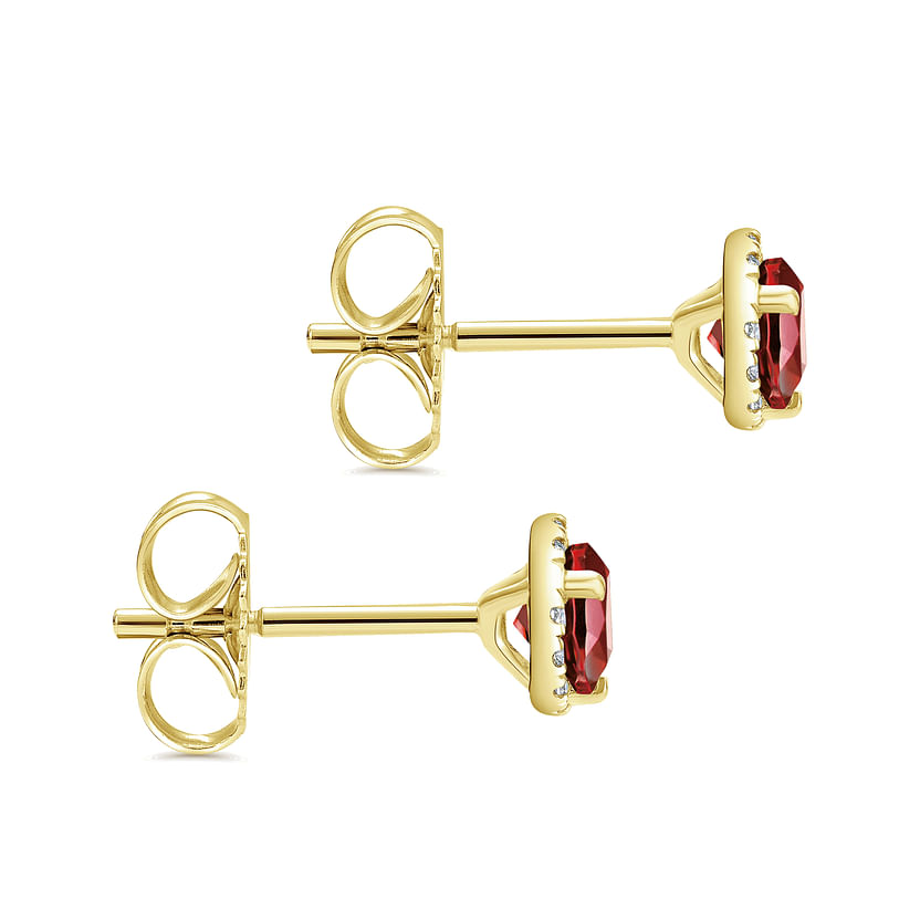 Gabriel & Co 14K Yellow Gold Round Halo Garnet and Diamond Stud Earrings with prong-set gemstones and butterfly backs, shown on a white background.